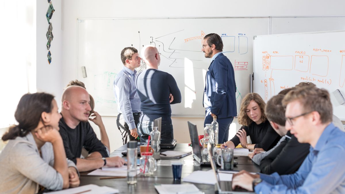 Group of happy people working in a conference room.