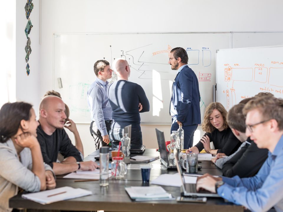 Group of happy people working in a conference room.