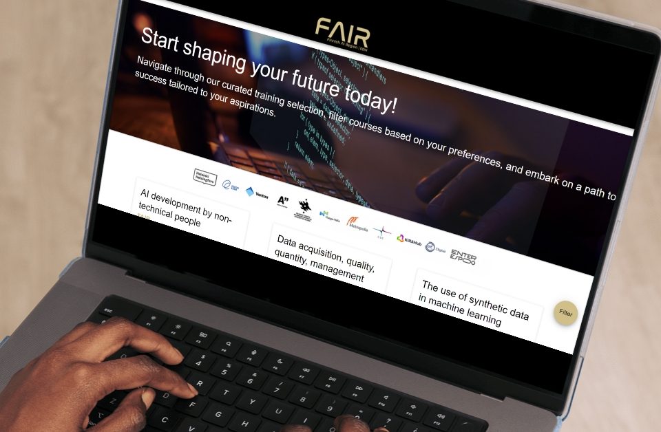 A person using a laptop displaying the FAIR training platform website.