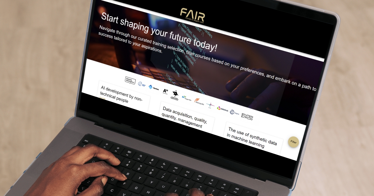 A person using a laptop displaying the FAIR training platform website.