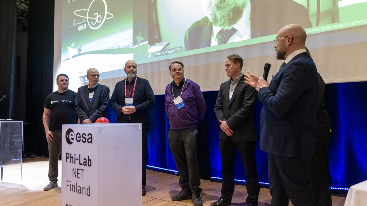 ESA Phi-Lab Finland consortium representatives on stage at the Winter Satellite Workshop.