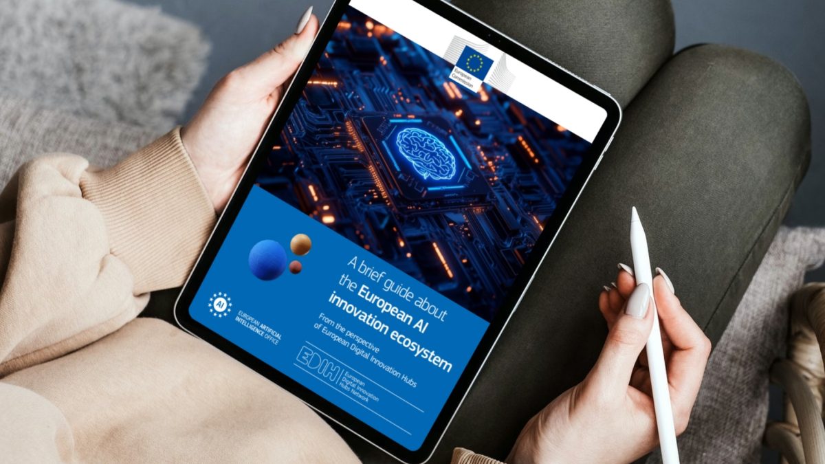 A person holding a tablet displaying the guide about the European AI innovation ecosystem.