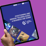 A hand holding the Positioning and sensor technologies: a business use guide on a purple background.