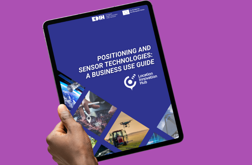 A hand holding the Positioning and sensor technologies: a business use guide on a purple background.