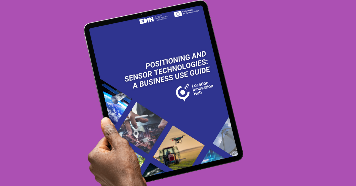 A hand holding the Positioning and sensor technologies: a business use guide on a purple background.