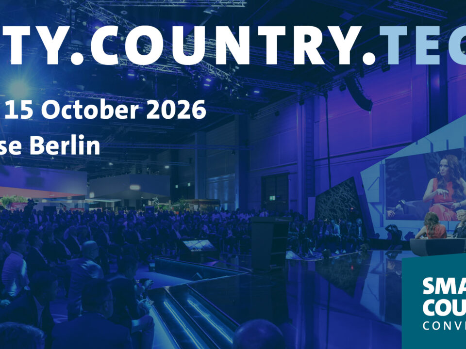 Audience and stage area at a technology conference. The image displays the text “CITY.COUNTRY.TECH”, the dates 13–15 October 2026, and the location Messe Berlin. The Smart Country Convention logo appears in the bottom right corner.