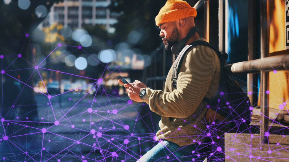 Person standing in an urban street setting, looking at a smartphone, with an abstract digital network overlay representing data connectivity.