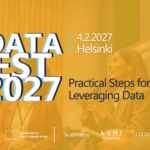 Promotional banner for DataFest 2027. The banner announces the event taking place in Helsinki on 4 February 2027 and features the theme 'Practical Steps for Leveraging Data'. The background shows a panel discussion with speakers on stage, overlaid with a yellow tint. Logos for DataStep, the European Union (co-funded), and supporting organisations LUMI AI Factory, IOXIO and VTT appear along the bottom.